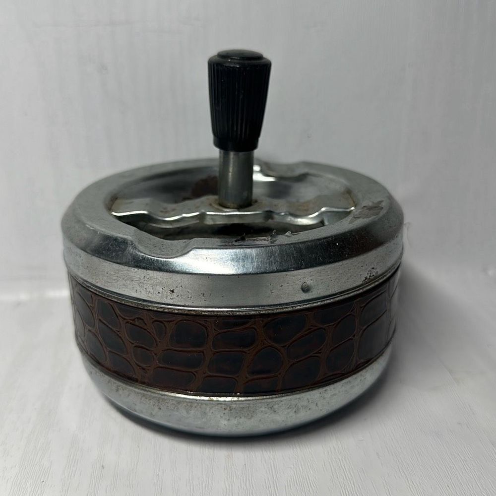 Gold Coin Metal ashtray with a snake-like pattern with a twist Made in Hong Kong